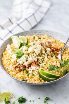 a bowl filled with mexican rice and garnished with cilantro