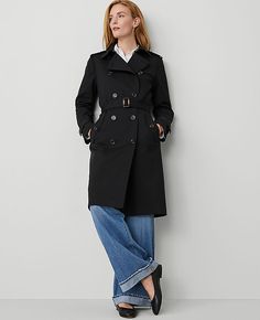 Elevate your wardrobe with the Ann Taylor Fitted Trench Coat, a perfect blend of style and functionality designed to keep you chic and dry, whatever the weather. This trench coat features a sophisticated black color and is tailored specifically for women, ensuring a flattering fit.

- **Size:** Large
- **Color:** Black
- **Material:** Shell: 78% Cotton, 20% Rayon, 2% Spandex; Lining: 100% Polyester
- **Gender:** Female
- **Features:** Notched lapel, long sleeves with button tabs, double-breasted Long Coat For Petite Women, Fitted Button-up Outerwear With Belted Cuffs, Classic Fall Workwear Raincoat, Classic Fall Raincoat For Work, Long Raincoat With Button Closure For Work, Double-breasted Fall Workwear Raincoat, Fall Workwear Double-breasted Raincoat, Fitted Winter Workwear Raincoat, Elegant Raincoat For Workwear In Fall