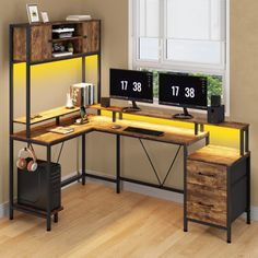 a computer desk sitting in front of a window next to a wooden shelf with two monitors on it