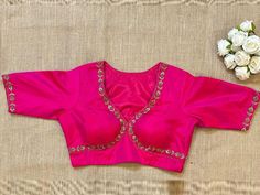 Shop fuschia pink embroidered designer sari blouse online in USA. Elevate your saree style with exquisite readymade saree blouses, embroidered saree blouses, Banarasi sari blouse, designer saree blouse, choli-cut blouses, corset blouses from Pure Elegance Indian fashion store in USA.-front