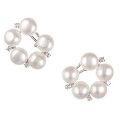 Circular clip post fresh water pearl and round diamond clip post earrings set in 18k white gold. 10 fresh water fine white cultured pearls, 11 x 7.5mm, excellent lustre and few blemishes 8 round full cut diamonds, approx. total weight .62cts, G, VS 18k white gold Tested: 18k Stamped: 750 24.0 grams Diameter: 28.84mm or 1.13 inches Depth: 10mm Diamond Tops, Baroque Pearl Earrings, Gold Clips, Freshwater Pearls Earrings, Fresh Water Pearl, White Gold Earrings, Lovely Jewellery, Cultured Pearls, Earrings Set