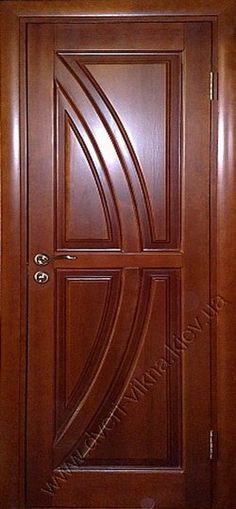 a wooden door with decorative carvings on the front and side panels, in dark wood