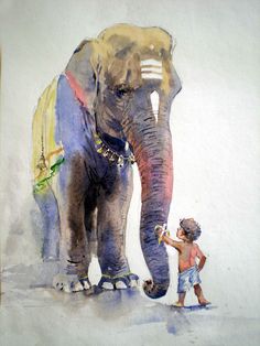 an elephant is standing next to a little boy