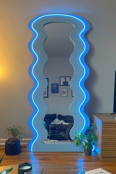 Wavy mirror. Blue aesthetic. Oversized mirror. LED aesthetic. Eclectic decor. Apartment Aesthetic Led, Custom Mirrors Diy, Bedroom Ideas Eclectic, House Decor Colorful, Funky Apartment Decor, Funky House Decor, Living Room Decor Colorful, Warm Apartment Aesthetic, Funky Apartment