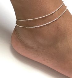 "Sterling Silver Adjustable Satellite Chain Anklet Double Layered Ankle Bracelet Minimalist and Dainty Ankle Bracelet Metal: All Components Are Made From Solid .925 Sterling Silver **Choose Size At Checkout** *Adjustable from 8\" to 9\" *Adjustable from 9\" to 10\" *Adjustable from 10\" to 11\" Please Read Store Policy Before Purchase You can find more anklets in my store here: https://www.etsy.com/shop/LinksAndStones?ref=simple-shop-header-name&listing_id=687470766&section_id=26197034 T Summer Gift Beaded Chain Anklets, Adjustable Beaded Chain Anklets For Summer, Adjustable Silver Beads Anklet For Summer, Adjustable Beaded Chain Anklet As Gift, Elegant Summer Anklets With Round Beads, Silver Anklets With Tiny Beads For Summer, Elegant Adjustable Anklet With Tiny Beads, Handmade Adjustable Delicate Anklets, Handmade Delicate Adjustable Anklets