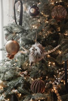 a christmas tree with ornaments hanging from it