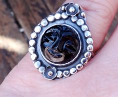 ☾Handmade, Natural Black Onyx Sterling Silver Carved Face Statement Rings☾ ❤︎Featured in this listing are sterling silver, handmade, natural stone rings. These lovely rings feature a beautiful, Hand Carved, Natural Black Onyx face carving gemstone. ~Handcrafted Flower details with granulation. ~Each ring is handmade, therefore no two are exactly alike. ~The face of the ring measures 27mm x 22mm ~A charcoal patina adds depth and enhances the details. ~All metals used: 925 Sterling Silver ~Each Ca Artisan Black Round Ring, Artisan Black Sterling Silver Rings, Face Carving, Black Onyx Ring, Onyx Ring, Lovely Ring, Rocks And Gems, Amethyst Ring, Opal Rings