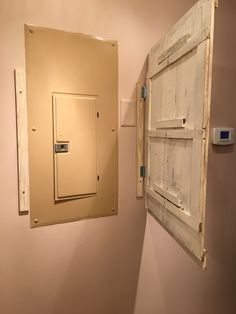 an old door is hanging on the wall