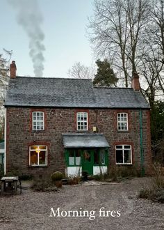 an old brick house with the words morning fires written on it