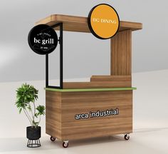 a small wooden stand with two round signs on it's sides and a potted plant next to it