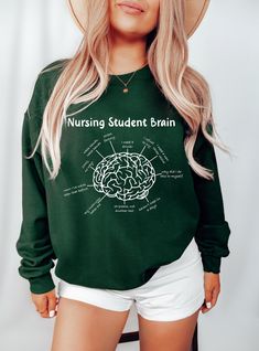 Elevate your nursing journey with our 'Nursing Student Brain' sweatshirt, perfect for nursing students and healthcare professionals alike. Designed for both comfort and style, this sweatshirt is ideal for wearing during nursing school or on your shifts as a registered nurse. Stay cozy and motivated while showcasing your passion for nursing. Order now and add some nursing flair to your wardrobe! Hello and a warm welcome to TeeTaniumCo! We're absolutely delighted to have you here. Elevate Your Wardrobe with our Premium, Soft, and Impeccably Crafted Shirts! Our shirts go beyond mere apparel; they embody a testament to craftsmanship and excellence. Meticulously tailored, luxuriously soft, each piece is carefully crafted by our devoted team. Your Shopping Experience is Paramount! We deeply valu Nursing Long Sleeve Relaxed Fit Sweatshirt, Long Sleeve Nursing Sweatshirt With Relaxed Fit, School Nurse, Nurse Sweatshirt, Nursing Student, Registered Nurse, Roll Up Sleeves, Nurse Life, Raleigh Nc