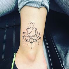 a woman's foot with a lotus tattoo on the left side of her ankle