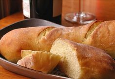 a loaf of bread sitting on top of a wooden table