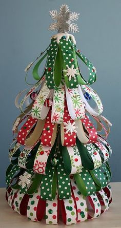 a christmas tree made out of ribbon and bows