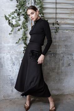 A striking design that exudes both sophistication and artistic charm. The Black Rosetta Skirt features a unique satin rosette embellishment at the waist, adding a touch of feminine flair to its minimalist silhouette. This elegant skirt flows beautifully, making it perfect for both casual and formal events. 
✨ #RosettaSkirt #BlackSkirt #ElegantStyle #MinimalistFashion #FeminineFlair #ChicLook #FashionStatement  #TimelessFashion #FallFashion #AutumnStyle🌹 Elegant Dinners, Festive Attire, Holiday Skirts, 3d Rose, Women's Bottoms, Winter Skirt, Elegant Skirt, Chic Top, Bold Design