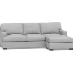 a white couch with a chaise lounger on the bottom and footrests