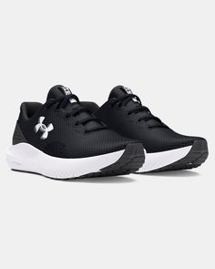 the under armour shoes are black and white