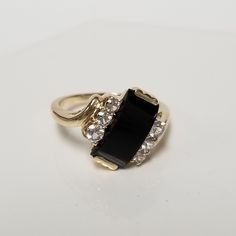 "Thanks for shopping our vintage estate store. We tend to sell well below wholesale and truly hope you enjoy all of our items. Many of the items are one of a kind, so please enjoy scrolling through the pictures and hopefully something will catch your eye. Beautiful vintage estate 10k yellow white gold black 3ct onyx .20ct CZ diamond cocktail ring. Retails $799 on sale $199 Ring size: 6.5 Setting: 1/2\" Band width: 2mm Weight: 3.07 grams Sweet ring, one that you will love. Marked 10k." Eye Beautiful, Sweet Ring, Diamond Anniversary Rings, Diamond Cocktail Rings, Cz Diamond, Cocktail Ring, Cocktail Rings, Rings Statement, Gold Black