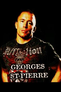 a man wearing a black shirt with the words george st pierre in front of him