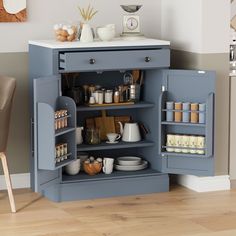 an open cabinet in the corner of a room