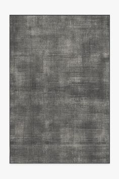 an abstract gray rug with black and white squares on the bottom, in front of a white background