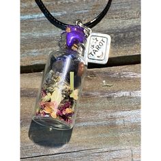 5mm Glass Bottle With Cork Features Tarot Card Charm As Pictures And Purple Wax On Top. Inside Of The Jar Are Mugwort, Black Tea Leaves, Oolong Tea Leaves, Rose Petals, Angelica Root, Moonstone, Amazonite, Lapis Lazuli, Clear Quartz, And Black Tourmaline. All Herbs And Crystals Are Said To Help Your Own Intuition Become More Active. This Helps In Life And Divination Too! As Per Etsy Policy These Items Are For Entertainment Purposes. Necklace Is Available In 18” Black Cord Or 22” Stainless Steel Spell Jar Necklace, Angelica Root, Jar Necklace, Black Tea Leaves, Diamond Drop Necklace, Amber Bead Necklace, Spell Jar, Glass Bottles With Corks, Car Charms Mirror