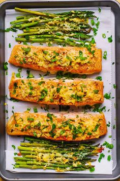 asparagus and salmon on a baking sheet