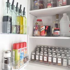 an open refrigerator filled with lots of different types of condiments and bottles on the shelves