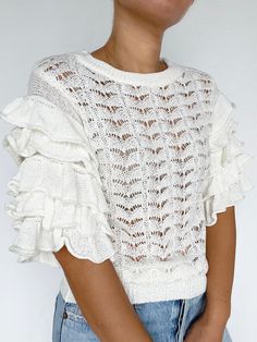 Cascading ruffles float down this charming knit top. This one-of-a-kind knit top features a ribbed neckline and hem. Cascading ruffle knit Knit top Ribbed Crewneck Oversized ruffled sleeves Length: 22 1/4" 80% Acrylic 20% Nylon Style #: G223WT5724 Cheap Ruffled Tops By Gap, Cute Cheap Tops With Ruffles, Cheap Ruffled Tops From Gap, Cheap Feminine Ruffled Crop Top, Cheap Fitted Ruffles Tank Top, Cheap Feminine Tops With Ruffles, Cheap White Ruffle Sleeve Tops, Cheap Ruffle Hem Tops For Beach, Trendy Cheap Tops With Ruffle Sleeves