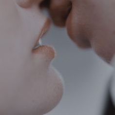 a close up of a person's nose with their reflection in the mirror