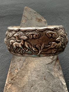 Bangle made of horn and silver (animal motifs) Silver Symbolic Bracelets For Ceremonial Use, Silver Symbolic Bangle For Ceremonial Occasions, Silver Carved Bracelet For Ceremonial, Silver Carved Ornate Bangle, Antique Carved Ceremonial Bangle, Vintage Silver Hallmarked Bangle, Ornate Hallmarked Sterling Silver Bangle, Vintage Silver Bangle, Collectible, The Bangles