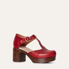 Meet our T-strap clog shoe, crafted from vibrant clear red leather in Portugal.  stands out with its bold color and classic design. Set on a sturdy cushioned platform, Kerstin offers both style and comfort. The T-strap provides a secure fit and an elegant touch, making it the perfect choice for adding a pop of color to any outfit. Heel 7.5 cm / 2.95 in Soft, flexible lightweight sole Leather lined Normal fit Clog Shoe, Clogs And Mules, Heel Grips, Shoes Too Big, Shoe Tree, Naha, Bold Color, Slipper Shoes, Clogs Shoes