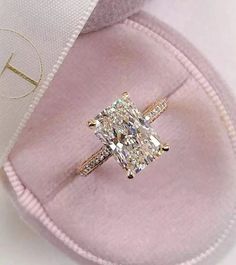 an engagement ring with a cushion cut diamond