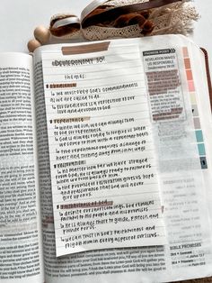 an open bible next to a pair of eyeglasses