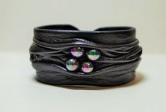 "Original, artistic adjustable genuine leather bracelet with black fresh water pearl. Measurements: 6\" (15 cm) X 1.2\" (3 cm) 6.5\" (16.5 cm) X 1.2\" (3 cm) 7\" (18 cm) X 1.2\" (3 cm) 7.5\" (19.5 cm) X 1.2\" (3 cm) If you need smaller or larger size please let me know. Base is made of light metal and it makes bracelet fully adjustable as it can be made smaller or larger by pressing the sides in or out. Please be mindful that leather jewelry is delicate and can break with rough use. Wipe your je Bracelet En Cuir Diy, Unique Leather Jewelry, Painted Handbag, Diy Leather Bracelet, Polymer Clay Bracelet, Leather Jewellery, Handmade Leather Bracelets, Genuine Leather Bracelet, Black Leather Bracelet