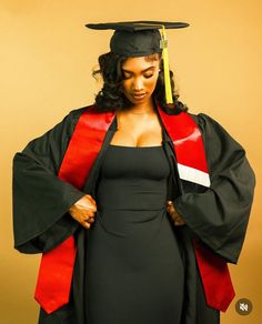 a woman in a graduation gown and cap is holding her hands on her hip as she poses for the camera