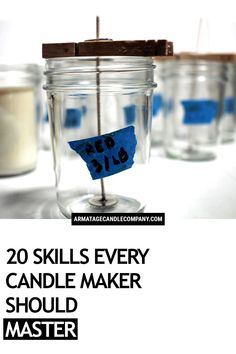 there is a jar with some blue stickers in it and the words 20 skills every candle maker should master