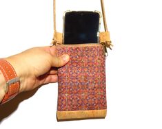 This small purse is perfect to carry your mobile phone. Portuguese Cork, one of the most popular materials used nowadays for accessories in line with leather. Its softness, high quality efficient properties as well as its vegan origin makes it a trend for today's jewellery. It a very ecological user friendly product for any use that fills your imagination! Try it and you will get a successful surprise! This is a high quality product of cork. Dimensions aprox.: Width: 10,5 cm Height: 18,5 cm  Thi Cork Purse, Cell Phone Bag, Small Purse, Phone Bag, Small Bags, Cross Body Handbags, Purses And Handbags, Cork, Mobile Phone