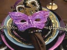 a purple mask sitting on top of a plate