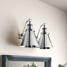 Bring some brightness to a modern farmhouse space with this 2-light vanity light. Crafted from cast brass, it features a circular backplate and a horizontal bar for a sleek look. It showcases a pair of cone-shaped shades that direct light exactly where you need it, making it perfect for getting ready in the morning. Under the shades, this luminary accommodates two bulbs up 100W (included). We recommend you pair an Edison bulb with it to introduce even more vintage-inspired appeal. Plus, it's com Light Vanity, Edison Bulb, Bathroom Vanity Lighting, Dimmer Switch, Vanity Light, Garden Lighting, Bathroom Fixtures, Vanity Lighting, Lighting Fixtures