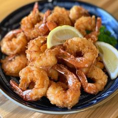 shrimp with lemon wedges and parsley on a plate