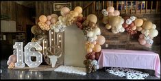 a table with balloons and decorations on it