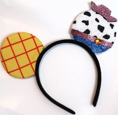 a minnie mouse ears headband with a pinata on it and a polka dot top