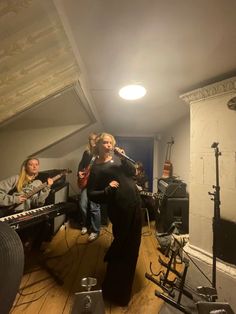 a group of people playing instruments in a room