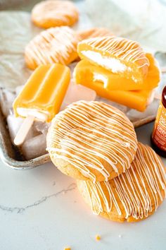 orange creamsice giant cookie recipe with vanilla butter on the top and an orange spread next to it