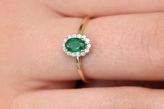 "Emerald Ring / 14k Classic Oval Cut Emerald Ring with Surrounding Diamonds / Natural Emerald Ring in 14k Solid Gold / Mothers Day Gift * If you would like to see the Matching Earrings Please Click Below https://www.etsy.com/listing/604292239/emerald-earrings-14k-oval-cut-emerald?ref=related-4 * If you would like to see the Matching Necklace Please click Below https://www.etsy.com/listing/590436480/emerald-necklace-14k-classic-oval-cut?ref=related-1 Item Features * Made to Order. * Gold KT: 14K Dainty Gold Band, Emerald Halo, Micro Pave Ring, Natural Emerald Rings, Future Engagement Rings, Local Jewelry, Sapphire Diamond Ring, Emerald Earrings, Halo Diamond Ring