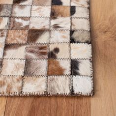 the rug is made up of several different animal hides on it's sides