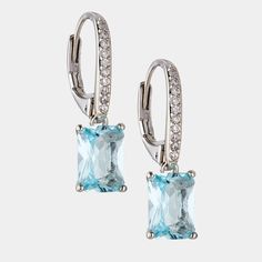 Striking and dramatic, these stunning emerald cut aquamarine-color drop earrings shimmer brightly when the light bounces off of the long, glamorous lines. ABOUT THE PRODUCT Metal: Sterling SilverPlating: RhodiumStones: Simulated Aquamarine-Colored GemstoneLength: 3/8 inWidth: 1/4 in Approximate diamond equivalent: 3.5 total carat weight Elegant Turquoise Emerald Cut Jewelry, Elegant Turquoise Emerald-cut Jewelry, Elegant Turquoise Jewelry With Rectangular Stone, Elegant Aquamarine Rectangular Jewelry, Elegant Rectangular Aquamarine Jewelry, Elegant Turquoise Rectangular Stone Jewelry, Elegant Aquamarine Baguette Cut Jewelry, Elegant Baguette Cut Aquamarine Jewelry, Elegant Aquamarine Drop Earrings