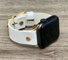 High Quality Pearl White Genuine Leather Bracelet. Designed And Handmade by Simeon D Jewelry Studio. Adjustable Size Bracelet Perfectly Tailored for Your Wrist - Plus Sizes Available! This Bracelet Fits ALL Apple Watch Series. Please Measure Your Wrist Before Submitting Your Order! Not For Other Models. Apple Watch Is NOT Included. Let's be Friends! Follow my Studio on Social Media Instagram @simeondjewelry Pinterest @simeondjewelry Facebook @simeondjewelrystudio Create Your Own Unique Style! Be White Adjustable Watch Accessories For Everyday Use, Adjustable White Apple Watch Band For Everyday, White Watch Bands With Bracelet Strap, White Leather Strap Watch Bands For Gift, White Leather Strap Watch Band As Gift, Luxury Adjustable White Watch Bands, Luxury White Adjustable Watch Bands, White Bracelet Strap Apple Watch Band For Everyday Use, White Watch Band With Bracelet Strap