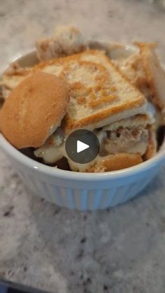 a bowl filled with sandwiches on top of a counter